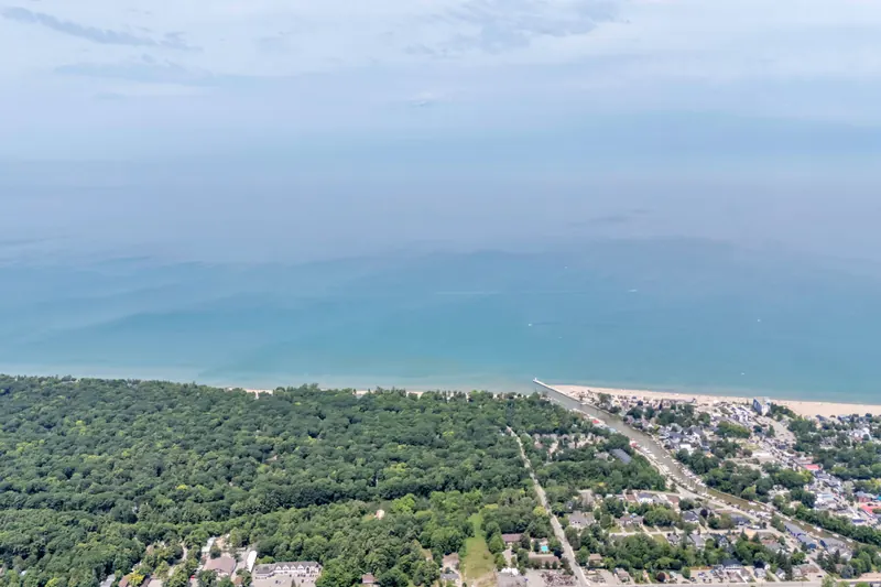High aerial of the Lake Huron shoreline at Grand Bend, north of Sarnia — drone real estate photography by Estate Shutter